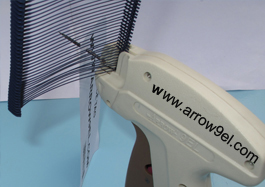 Pierce the needle of the tag gun into the price tag hole